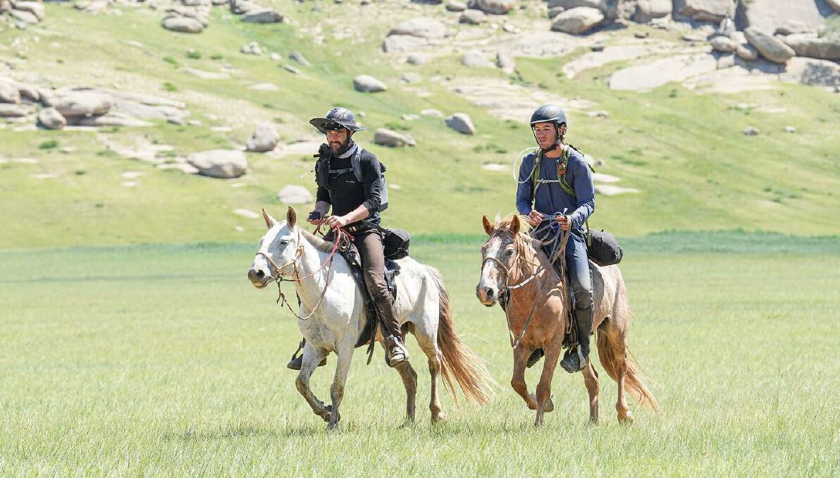 FINISH: Tyler Donaldson-Aitken (left) and Howard Bassingthwaight ride to the finish line of the Mongol Derby. Picture: Mongol Derby/The Equestrianist