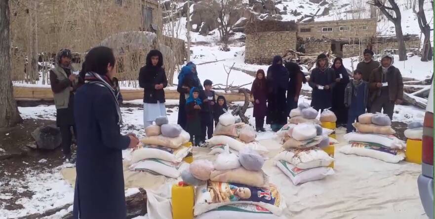 WELCOME: Afghan families receive food in a mountain village in Afghanistan after a secret aid mission from Ballarat. Picture: supplied
