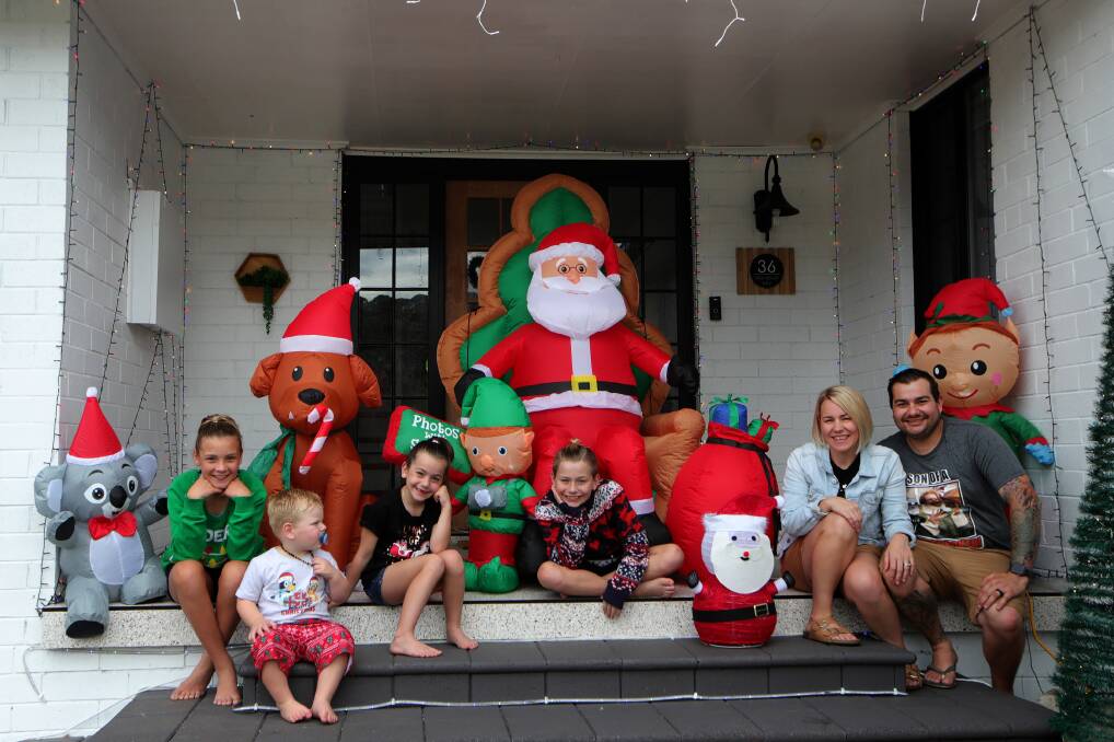 Tara and Mitchell Formosa with their kids Mia, Ava, Taj and Jax with some of the decorations at their Barrack Heights home. Picture: Sylvia Liber
