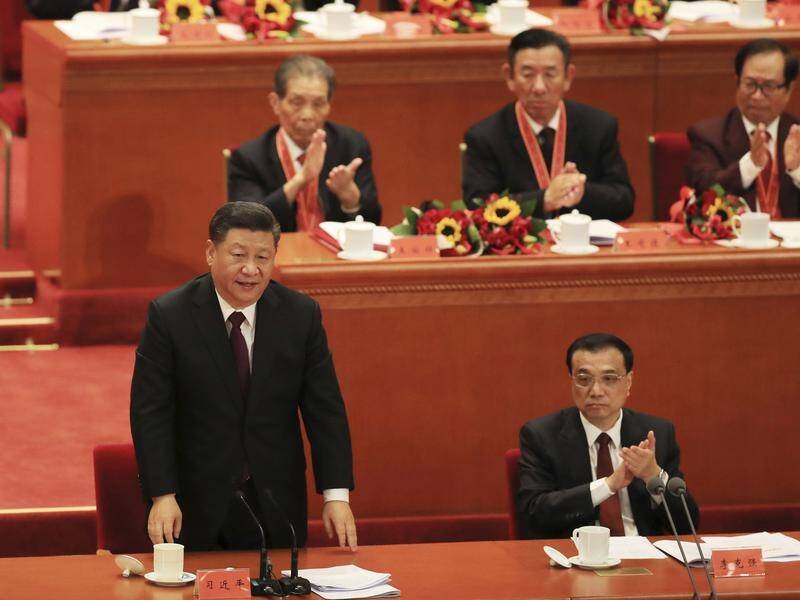 President Xi Jinping (L) speaking at a ceremony to mark the 40th anniversary of China's opening up.