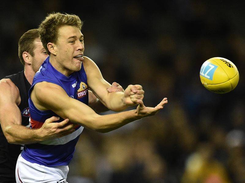 An in-form Jack Macrae will lead the Western Bulldogs side against Collingwood on Friday night.