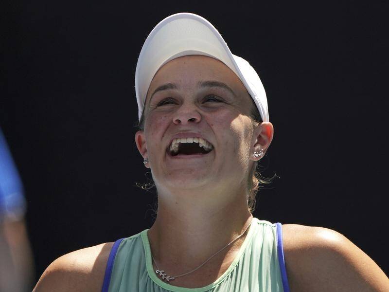 Ashleigh Barty is all smiles after advancing to the Australian Open semi-finals.