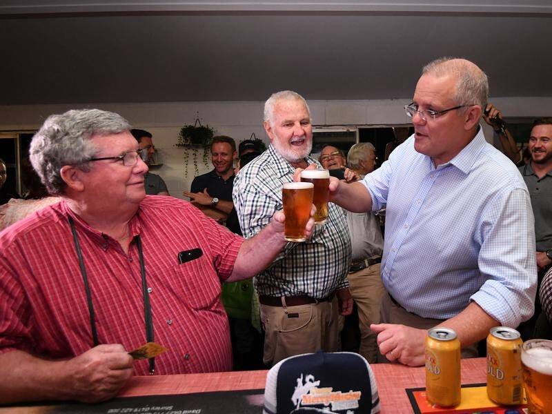 Scott Morrison(R) is visiting disaster-hit areas of Queensland on his first trip since the election.