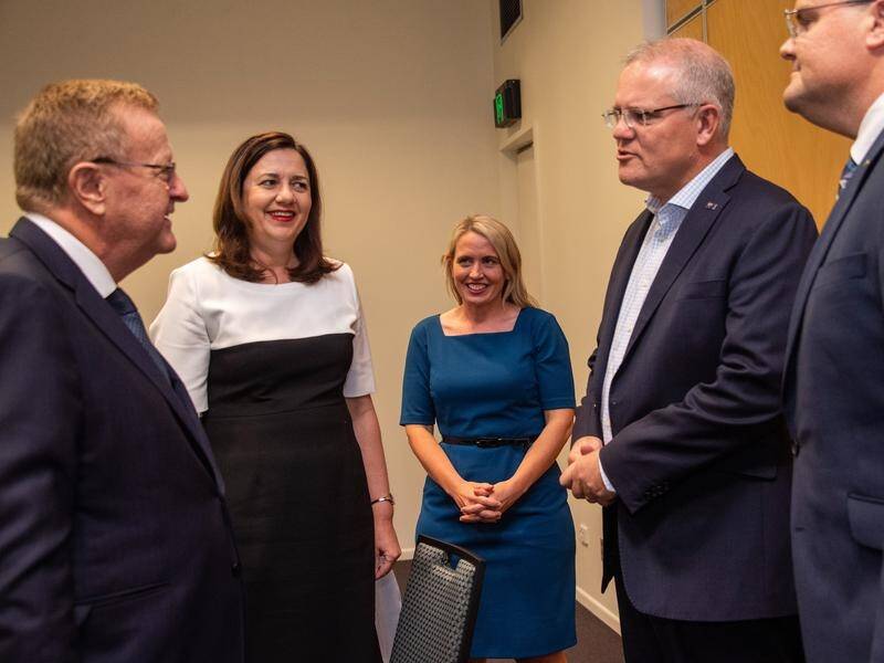 Scott Morrison (2nd right) says it's worth spending money to bid for the 2032 Olympics in Queensland