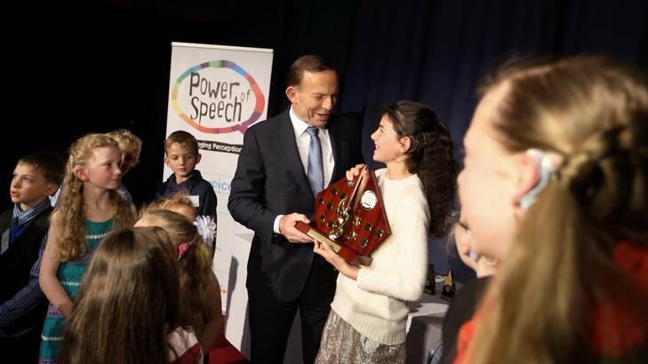 Prime Minister Tony Abbott presented Claudia Worland with a Power of Speech award at Parliament House. Photo: Andrew Meares