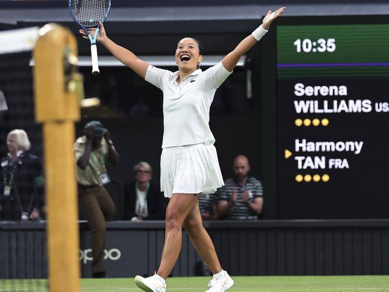 Harmony Tan of France reacts after beating seven-time champion Serena Williams at Wimbledon.