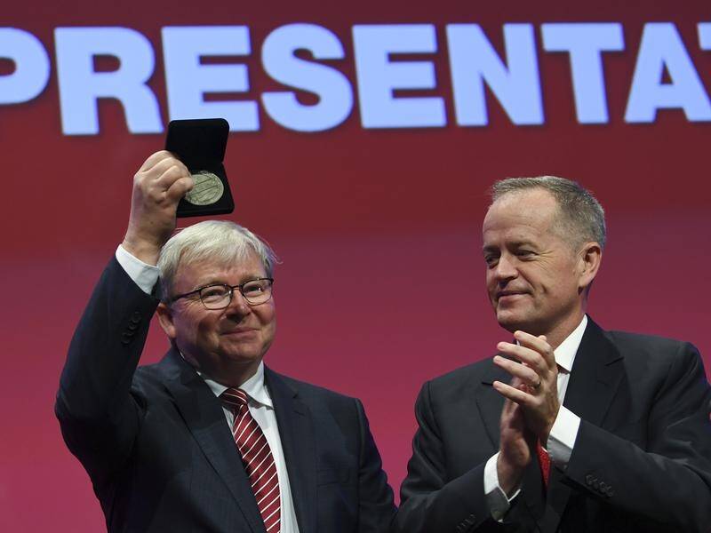 Former PM Kevin Rudd is congratulated by Bill Shorten during the carefully managed Labor conference.
