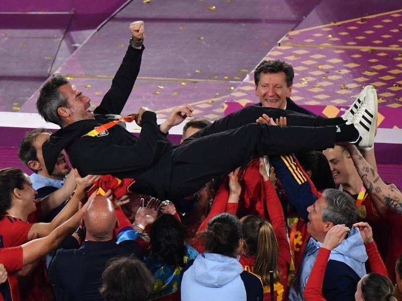 Spain's players and staff hoist coach Jorge Vilda after winning the Women's World Cup in Sydney. (Bianca De Marchi/AAP PHOTOS)