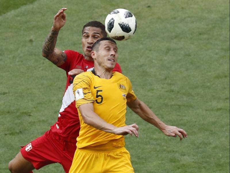 Australia's improved FIFA ranking has kept alive Mark Milligan's hopes of playing in England.