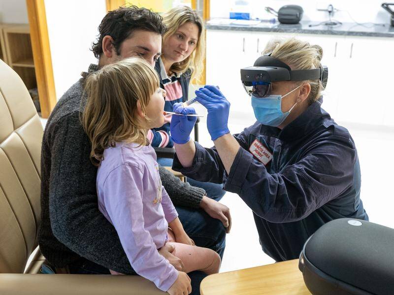 Sarah Carr uses a mixed reality headset to treat patients at the Bush Nursing Centre in Dargo. (DARRIAN TRAYNOR)