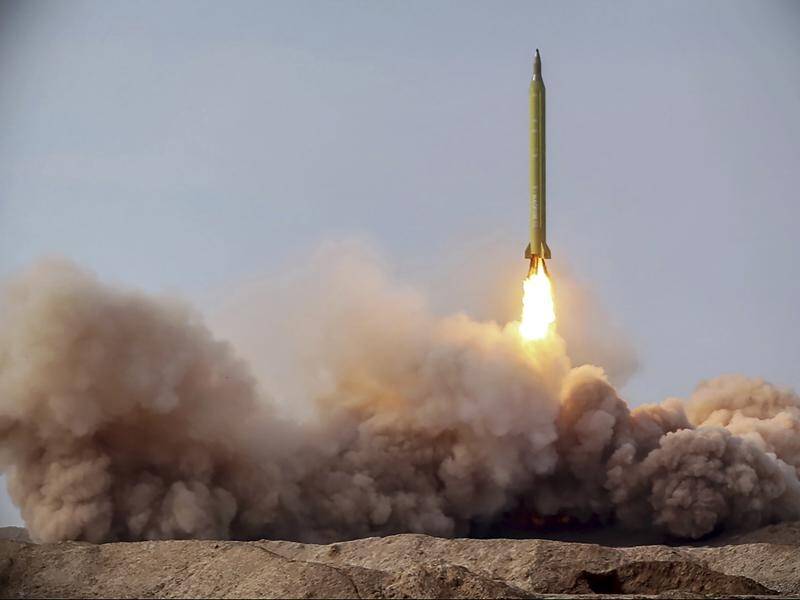 Iran has unveiled a new long-range missile that could reach US bases in the region and Israel.