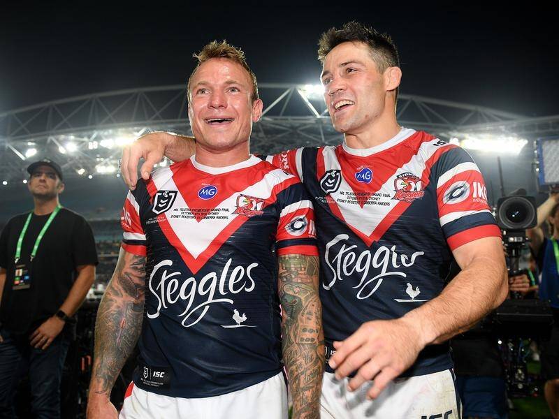 Jake Friend (left) celebrates winning the 2019 NRL grand final with Roosters' teammate Cooper Cronk.