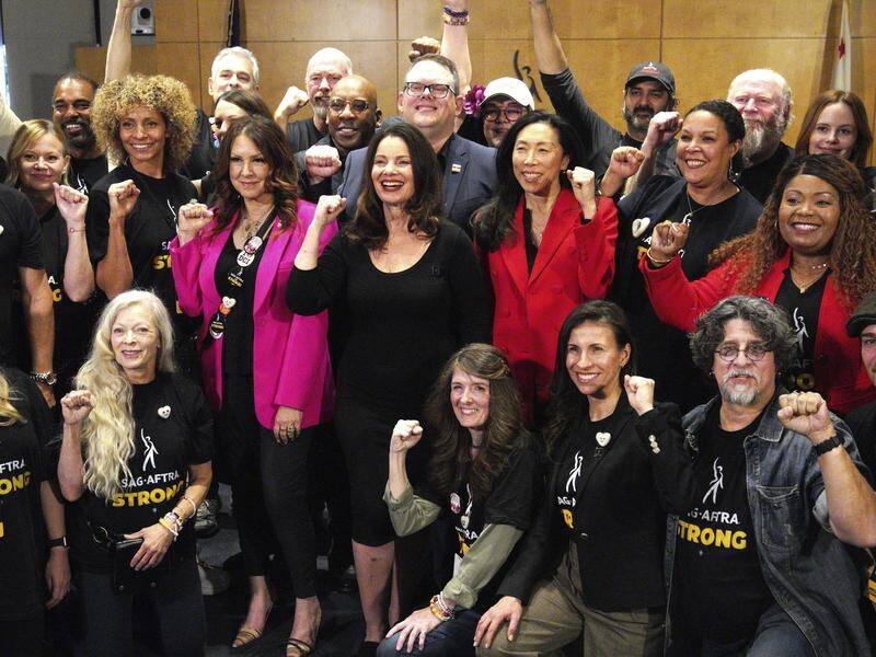 SAG-AFTRA President Fran Drescher (centre) says the deal is "a golden age" for the actors' union. (AP PHOTO)