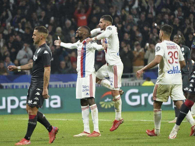 Lyon celebrate Karl Toko Ekambi's goal in their Ligue 1 defeat of Monaco.