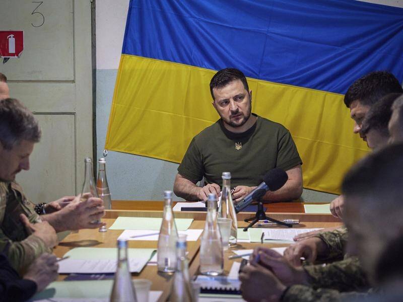 President Volodymyr Zelenskiy attends a meeting with military officials in the Mykolaiv region.
