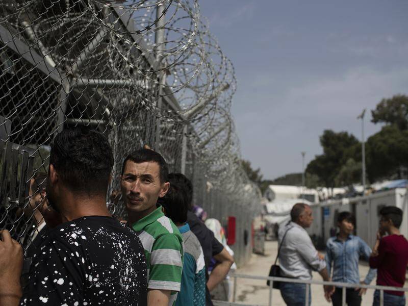 Greece is replacing refugee camps with holding centres as it struggles with an influx of migrants.