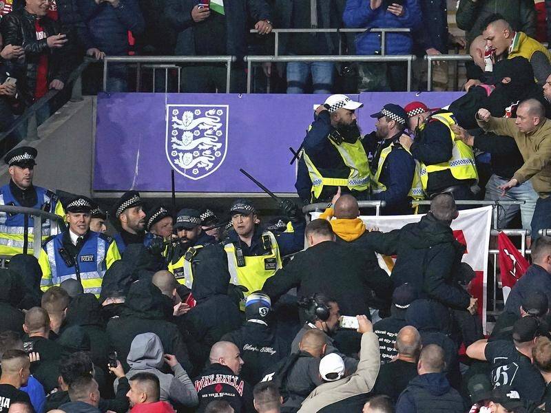Hungary fans clashed with police in the Wembley stands during the World Cup match with England.