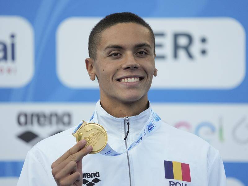 Romania's David Popovici has won European championship 100m freestyle gold in a world-record time. (AP PHOTO)