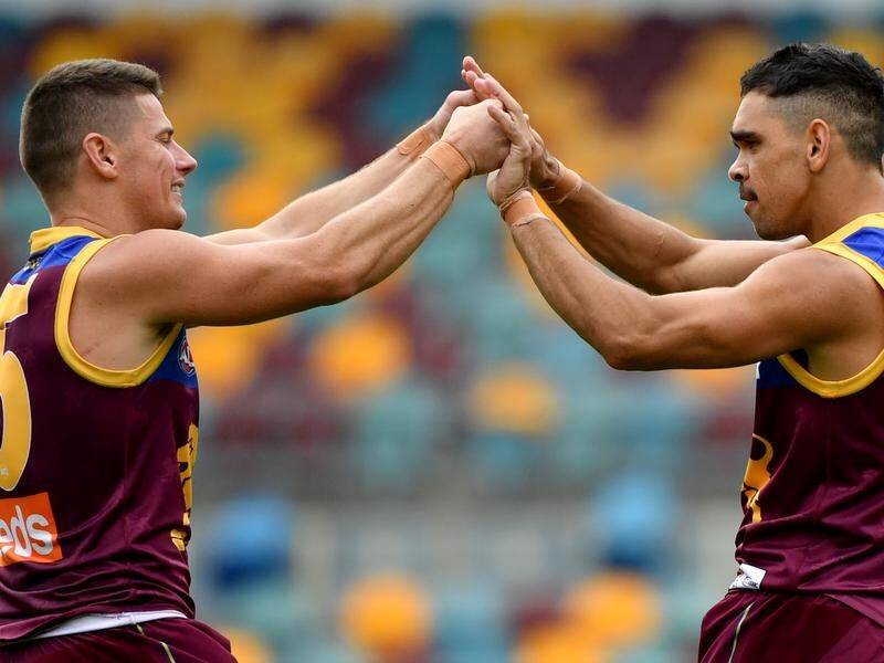 Brisbane skipper Dayne Zorko (L) is back from injury for the Lions' AFL showdown with Geelong.