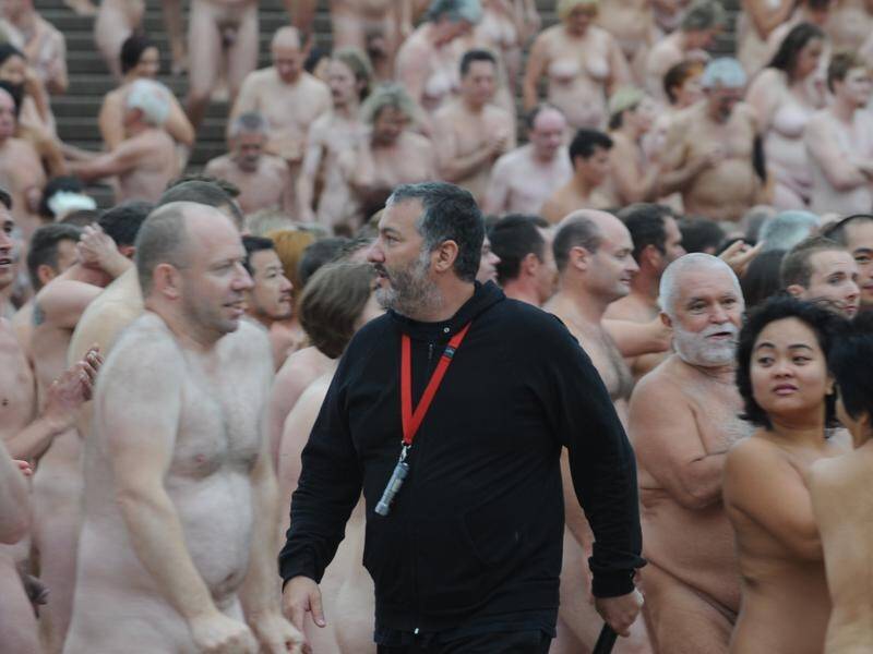 Spencer Tunick walks among the 5000 people photographed at the Sydney Opera House in 2010. (Dean Lewins/AAP PHOTOS)