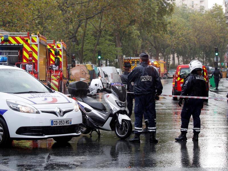 Police at the scene of an attack near the former Charlie Hebdo offices in Paris.