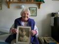 Mrs Doris Johnson, 91, with a photo of her late husband Neville Johnson. Photo: Eddi Jim