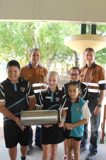 TIME CAPSULE: Jake Spencer and Darren Nyen, at back, with Christopher O’Toole, Tia Bird, Shoshone Lupton and Patricia Lingard with the time capsule.
