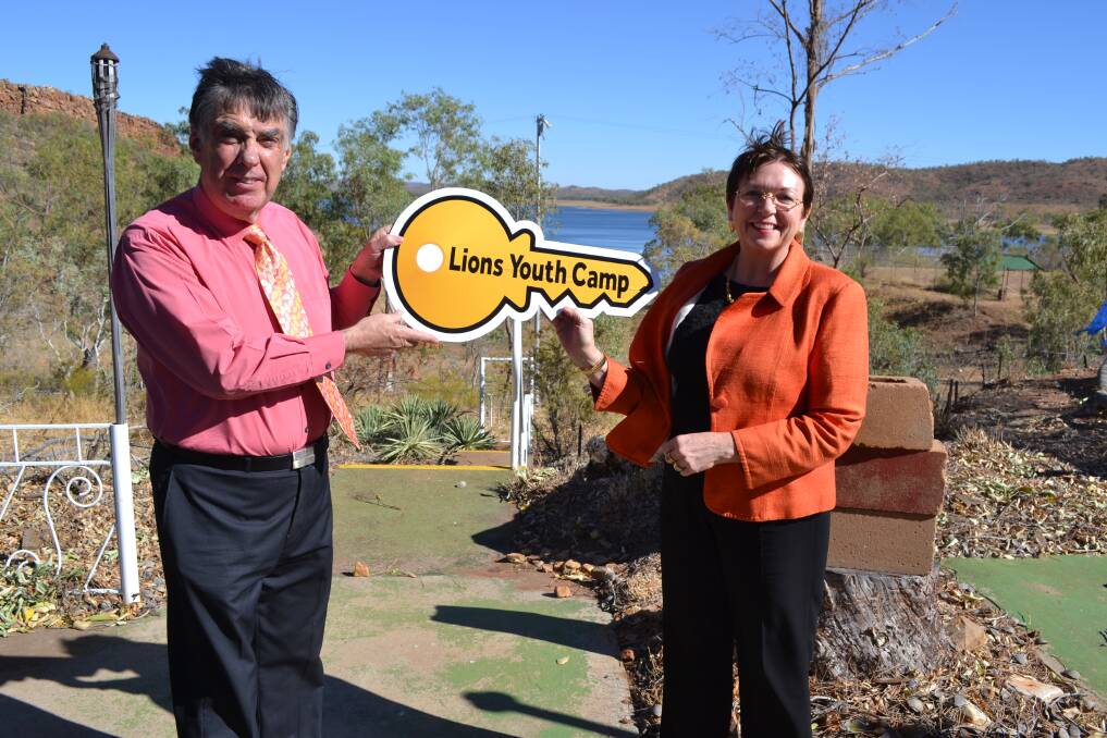 TRANSFER: Mount Isa mayor Tony McGrady receives the symbolic key to the former Lions Club youth camp from Mount Isa Water Board chairwoman Rowena McNally. The camp overlooks Lake Moondarra.