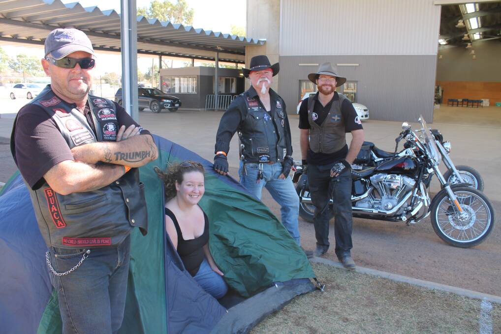 GOOD PROTECTION: Bikers United Against Child Abuse (BUACA) Desert Chapter vice-president Shane Jennings, president Ben Olesen and volunteer Nut Ledgard checked up on Sydney traveller Min Munro to make sure her site was up to standard. 
– Picture: HAILEY RENAULT