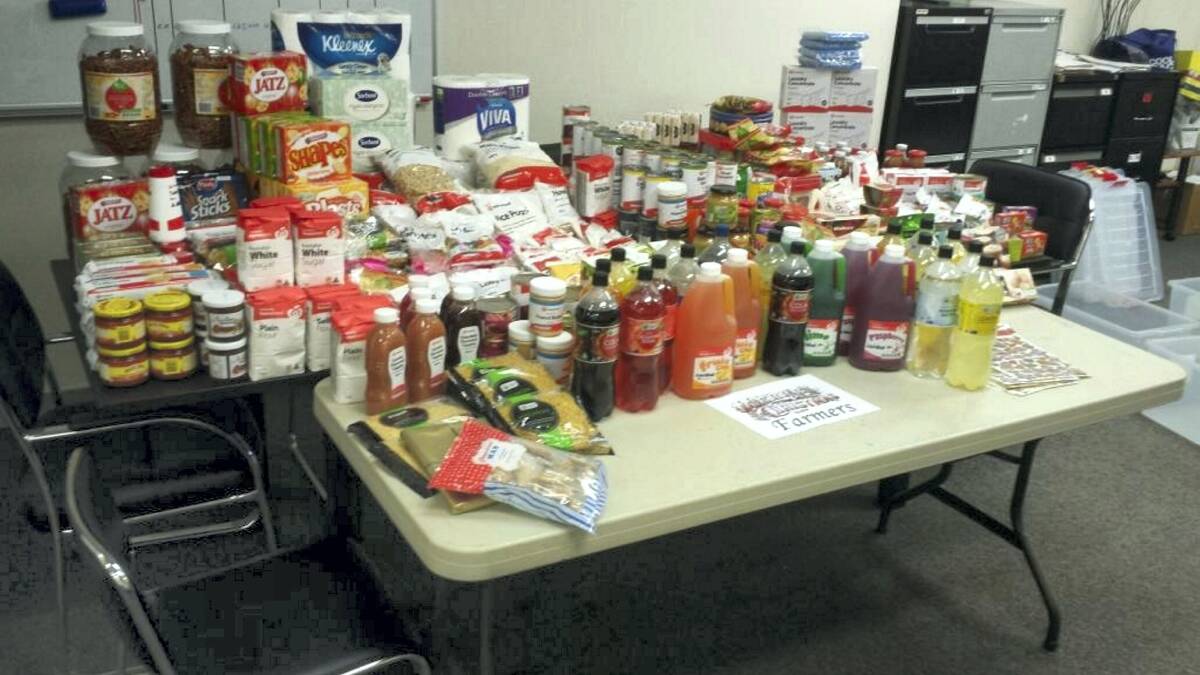 BOUNTY OF FOOD: Food collection at Mount Isa’s LJ Hookers, which was donated to Mount Isa Care Packages on Wednesday. 
