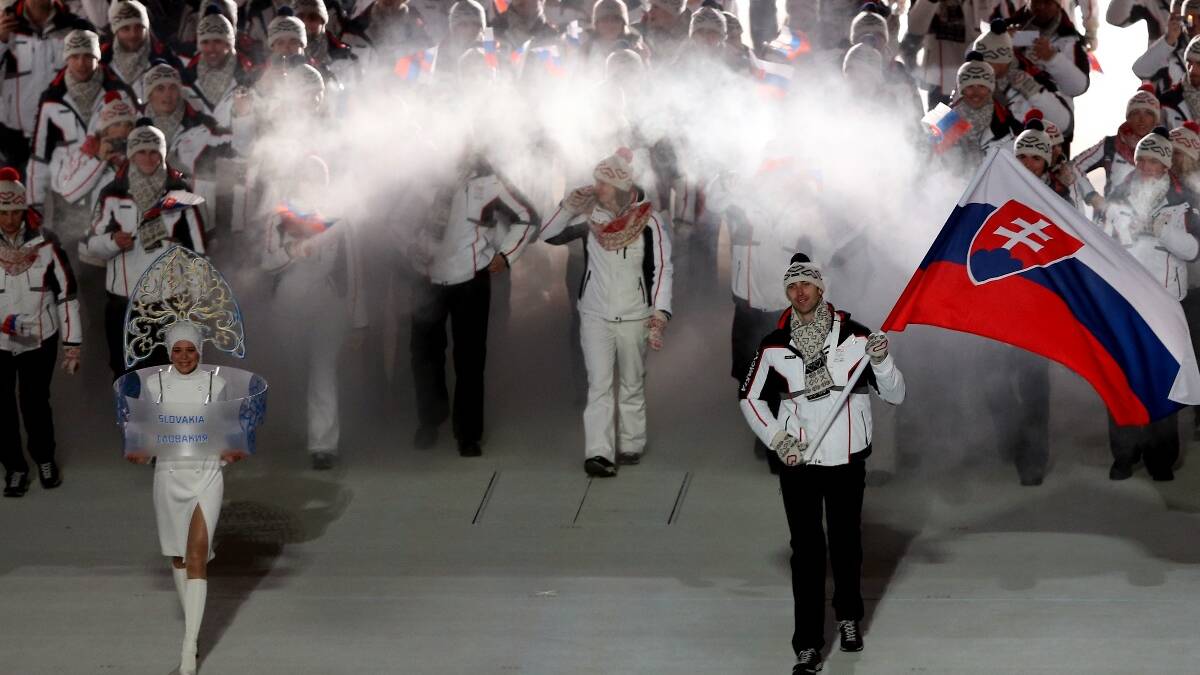 Ice hockey player Zdeno Chara of the Slovakia Olympic team carries his country's flag during the Opening Ceremony of the Sochi 2014 Winter Olympics. Picture: Getty