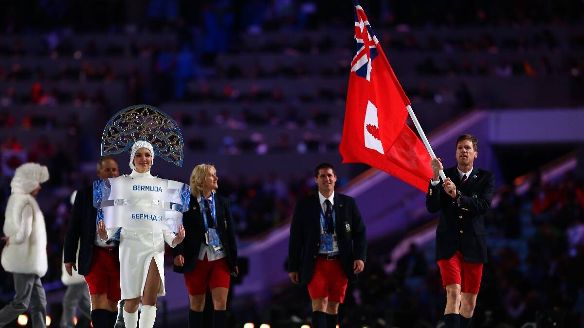 Cross country skier Tucker Murphy of the Bermuda Olympic team carries his country's flag during the Opening Ceremony of the Sochi 2014 Winter Olympics. Picture: Getty