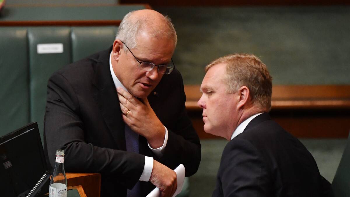 Prime Minister Scott Morrison (left) confers with House Speaker Tony Smith on another matter earlier in the year. Picture: Getty Images