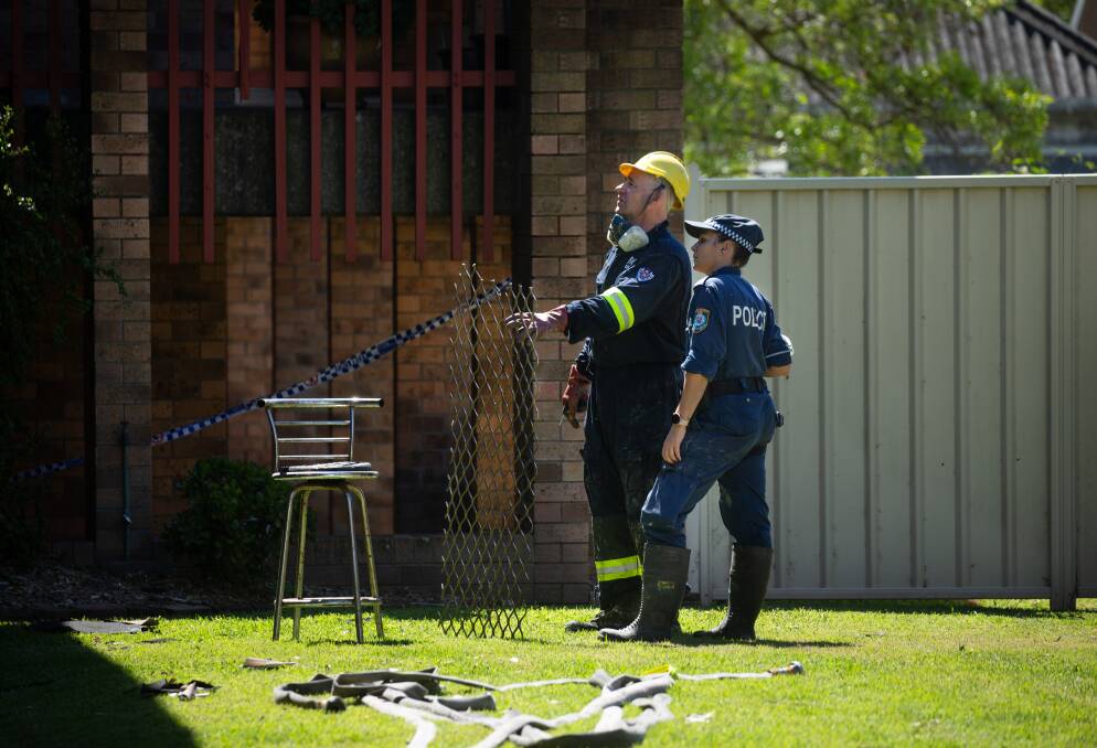 Investigators go over the scene on Thursday afternoon. Picture: Marina Neil