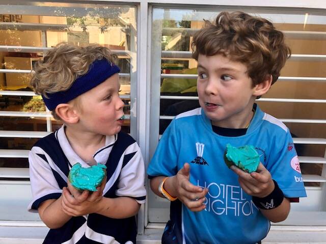 HELPING: Freddie, 7, and Archie, 5, eating blue pancakes and making blue cupcakes to help celebrate Do It For Dolly Day.