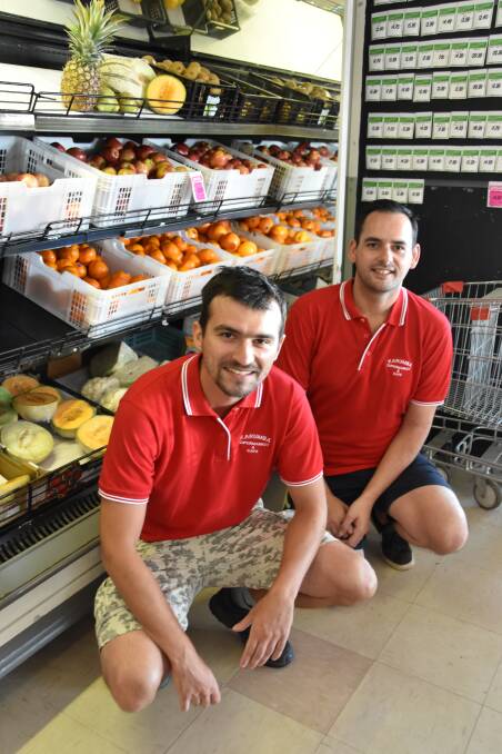 Karumba Supermarket and Cafe workers Adam Olszanski and Kaara Teinakore.