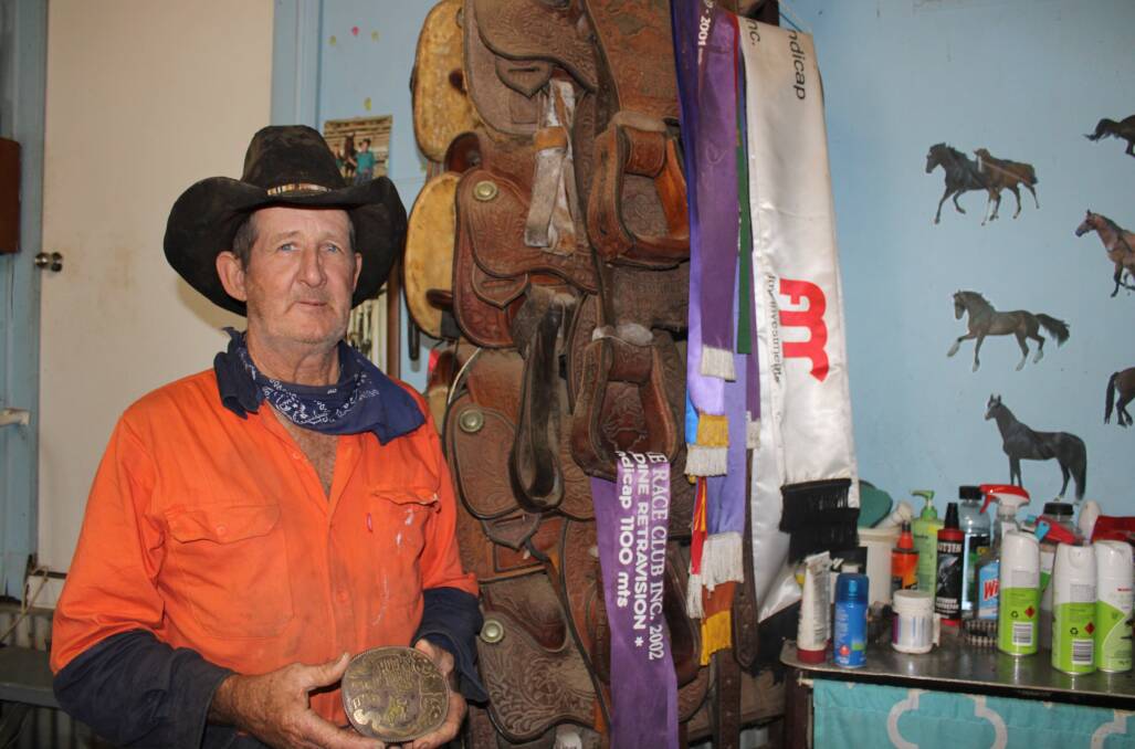 Ray built a saddle tree to accommodate his seven Australian saddle bronc trophy awards. 