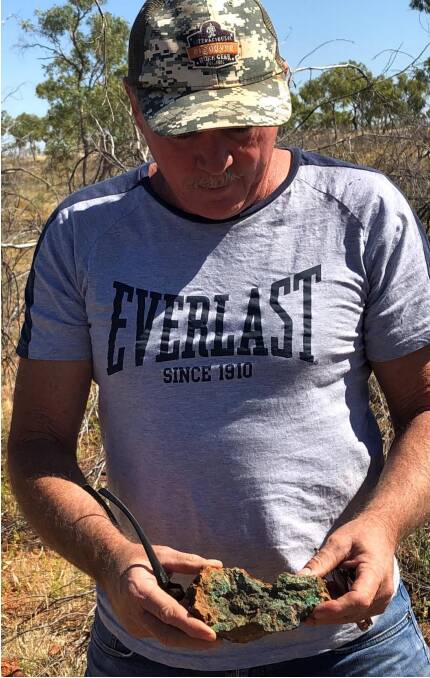 Michael Burnett holding an example of Judith mineralisation. Picture: supplied. 