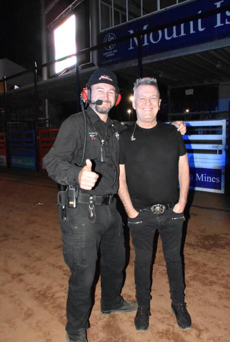 LEGEND: Jimmy Barnes poses with a fan before taking the stage in the rodeo arena. 