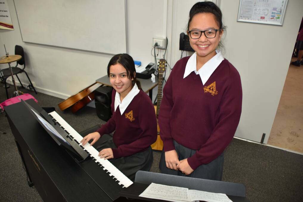 MUSICAL CHARMS: Good Shepherd Year 12 students Isabella Fahey and Ariane Ventura having been brushing up on their musical skills ahead of the Mulkadee Youth Arts Festival. Picture: Lydia Lynch. 