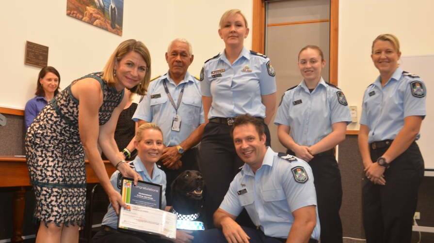 Mayor Joyce McCulloch presents a grant for $4000 to Queensland Police Service members (including PD Flynn) for its PD Sarge program last year.