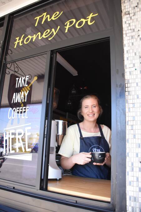 Lauren Conti serves up coffee at the Xtra Mile's Honey Pot room. 