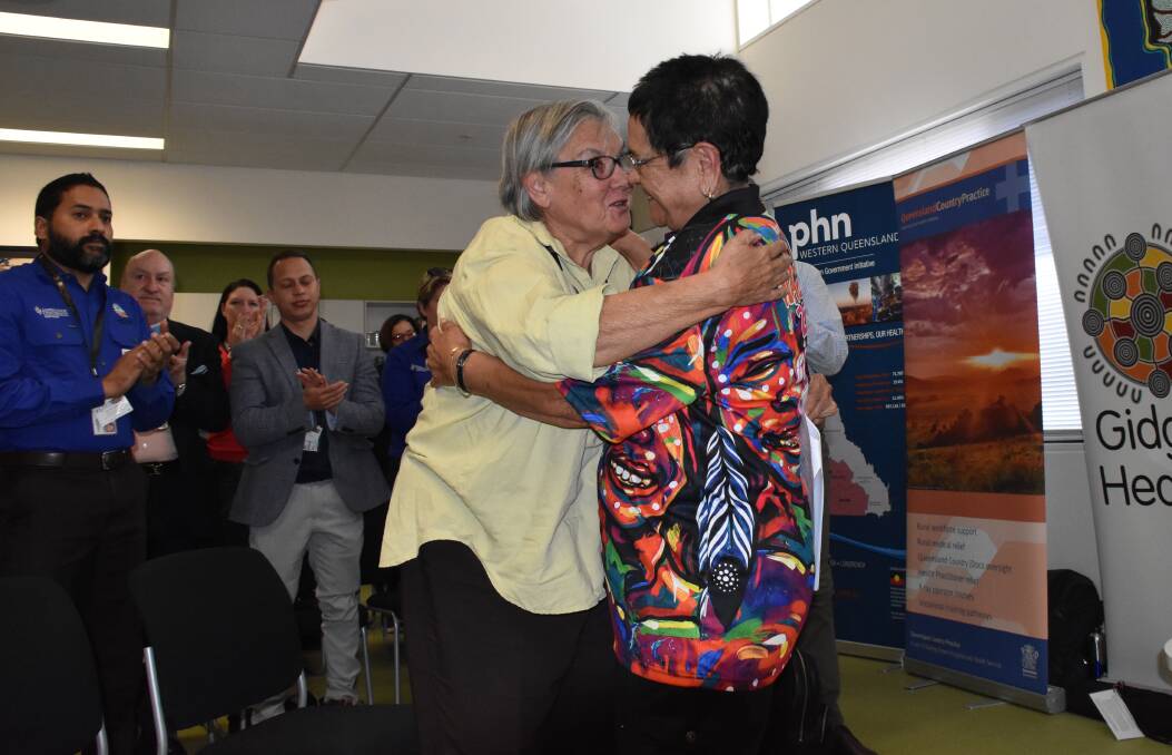 Pat Anderson embraces Adjunct Associate Professor Aunty Karen West after her powerful welcome to country at JCU's Are You Remotely Interested  Conference in Mount Isa. 

