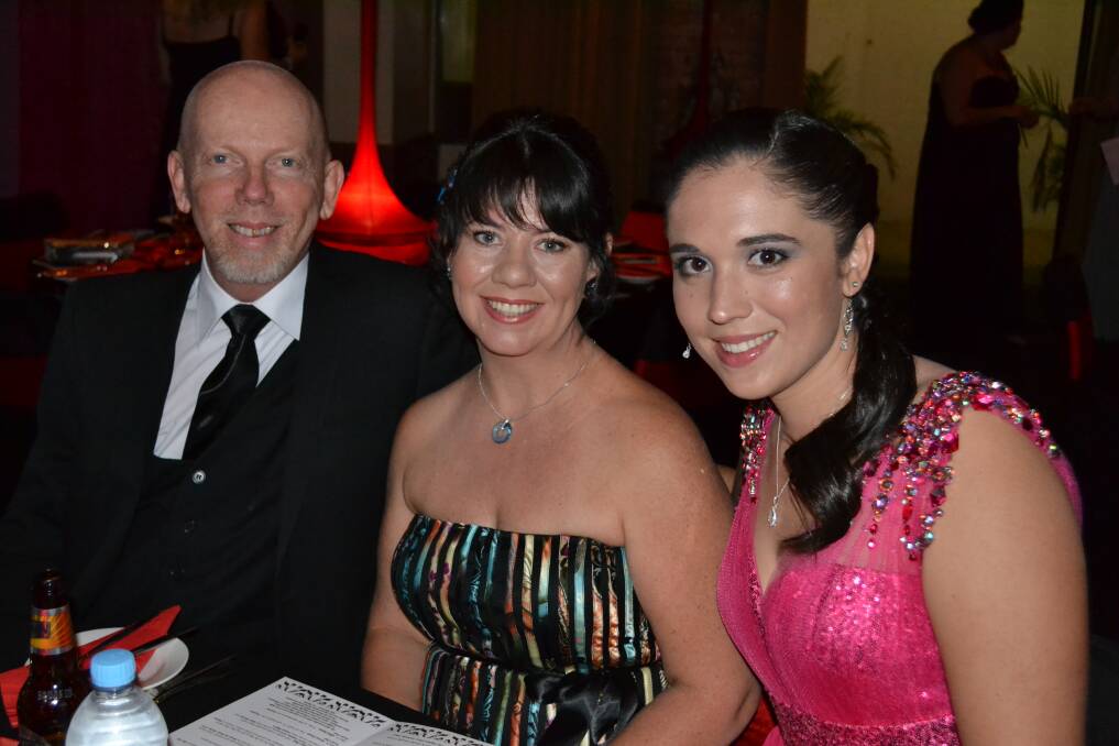 FANCY: Graham Staier, Kelly Waters and Kirsten Vella get ready for a big night ahead.