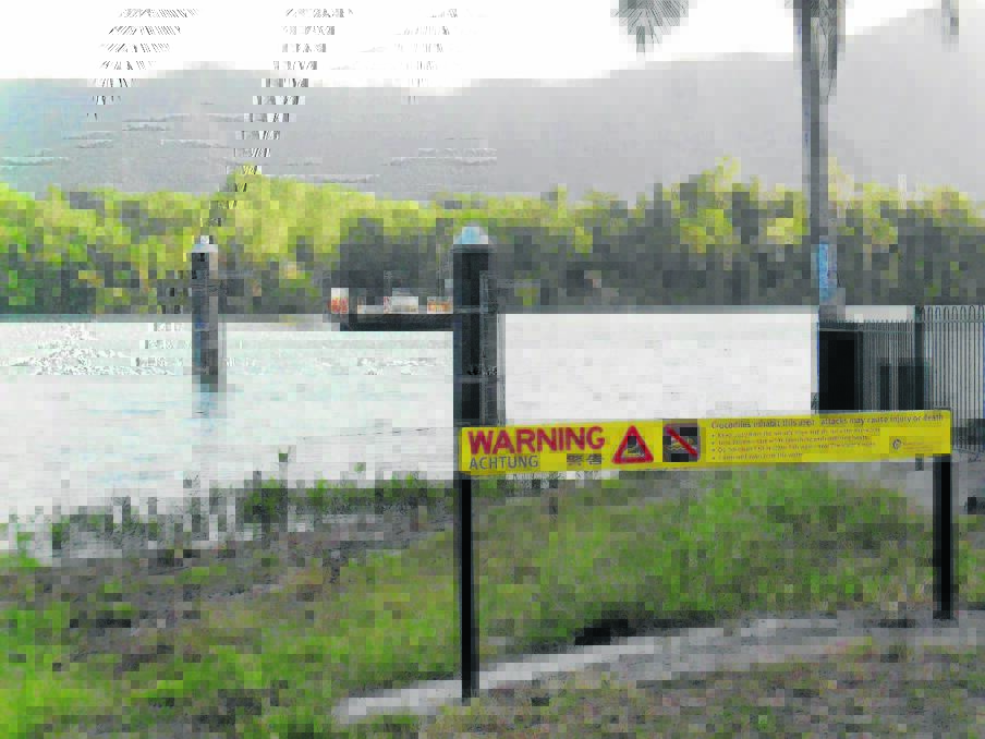 FERRY: The view of the Daintree River ferry with its somewhat confronting reminder of crocodile safety.