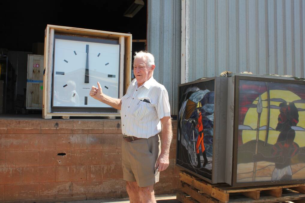 FINALLY: Town clock supporter Bob Keoghan with the new clock faces. - Picture: LAURA MARSHALL/1089.