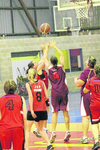 BLAZING DEFENCE: Blazers player Bonnie MacRae gets above Leah Wilcox as she attempts to take a shot for Pumas in the team's round 12 Mount Isa Basketball Association clash. - Picture: LYNDON KEANE/2880