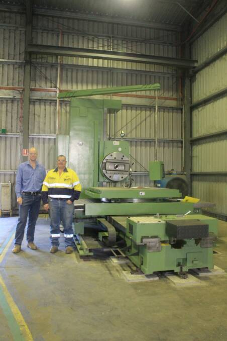 STRONG FUTURE: Barkly Engineering acting general manager Mitch Warrener and machine shop supervisor Stephen Byrnes with the new horizontal borer invested in by the company. - Picture: EMMA KENNEDY/7779