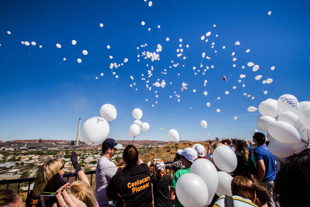 SUICIDE PREVENTION: Marchers release white balloons from the look-out, after walking up the hill.