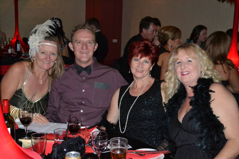 SPARKLE: Michele Harvey, Graham and Tracey Wylie and Kerry Owens have a few drinks at the Moulin Rouge Hospital Ball.